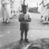 Me holding court with all Joyce's friends at her first communion. Philly, Pa.  The almighty Tootsie-Pop.