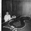Me and bro Mike making many left hand turns.  Mike, can you look more bored?  They don't make race car sets like that anymore! (Eldon) See the ping pong ball under the overpass?  Dad finished this basement all by himself.